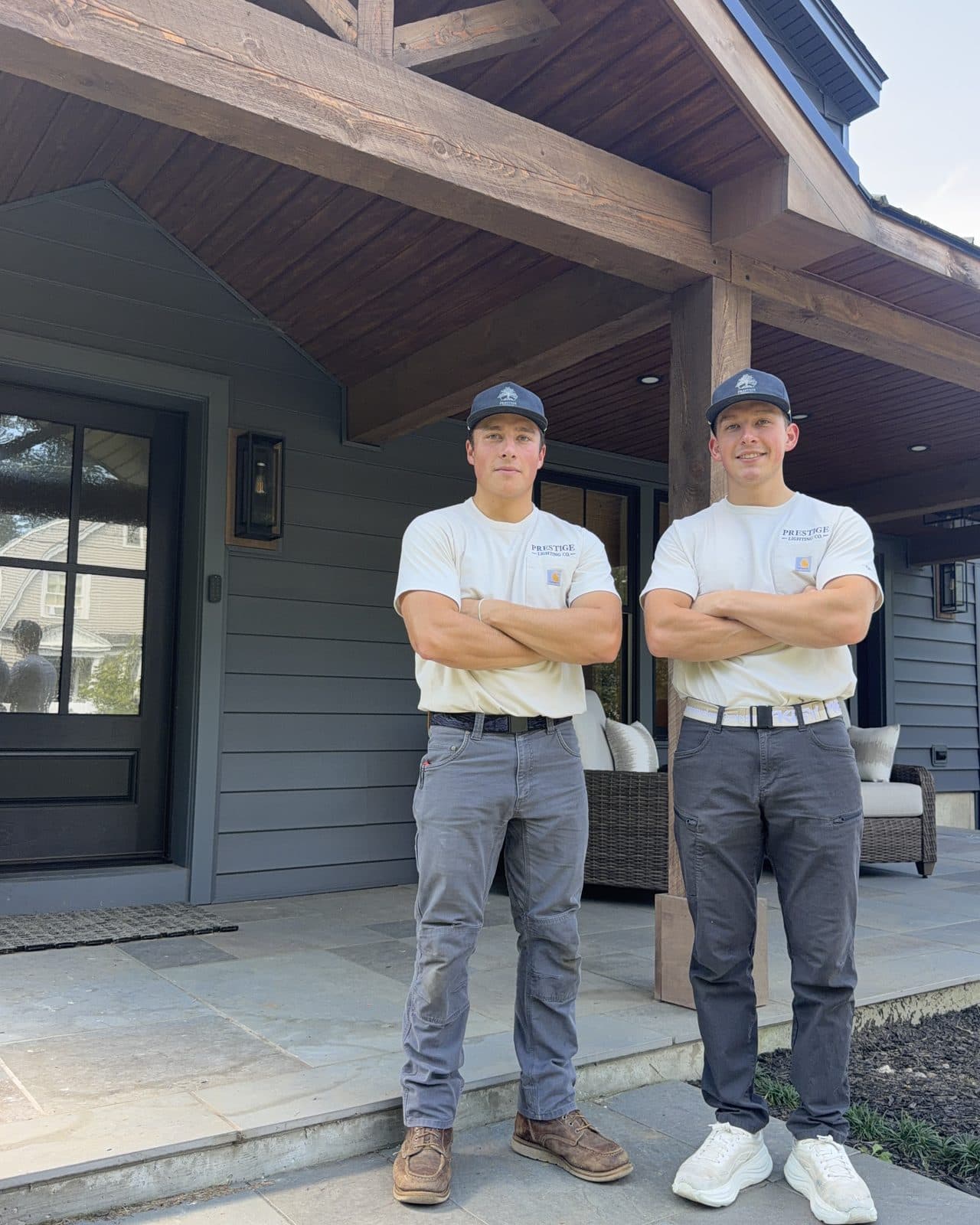 Elijah (left) and Aaron Livingston in Prestige Lighting shirts on a client’s porch